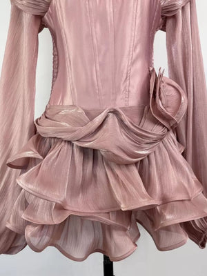 Pink ruffled mini dress with corset waist and draped detail
