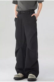 Black men's wide-leg sweatpants with pockets and a relaxed fit.