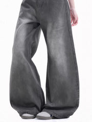 Men's relaxed fit wide-leg jeans in faded grey cotton with a washed denim look.