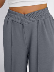 Dark Gray V-waistline palazzo sweatpants with center seams and elastic waistband.