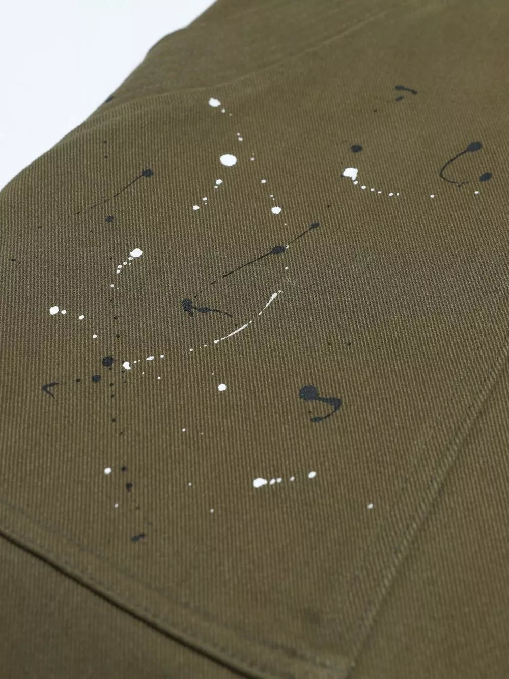 Olive cotton cargo pants with black and white paint splatter design