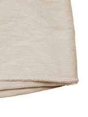 Beige linen blend mini skirt with asymmetrical hem and knotted buckle detail