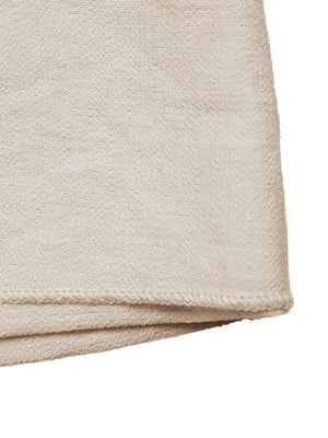 Beige linen blend mini skirt with asymmetrical hem and knotted buckle detail