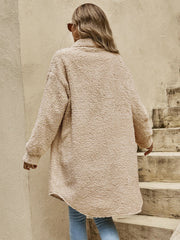 Oversized teddy bear shacket in camel with button-down front and long sleeves.