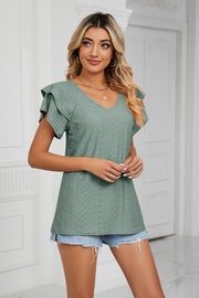 Teal eyelet knit v-neck blouse with flutter sleeves and a relaxed fit.