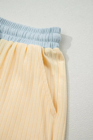 Color block ribbed two-piece set with elastic waistband and pocket detail.