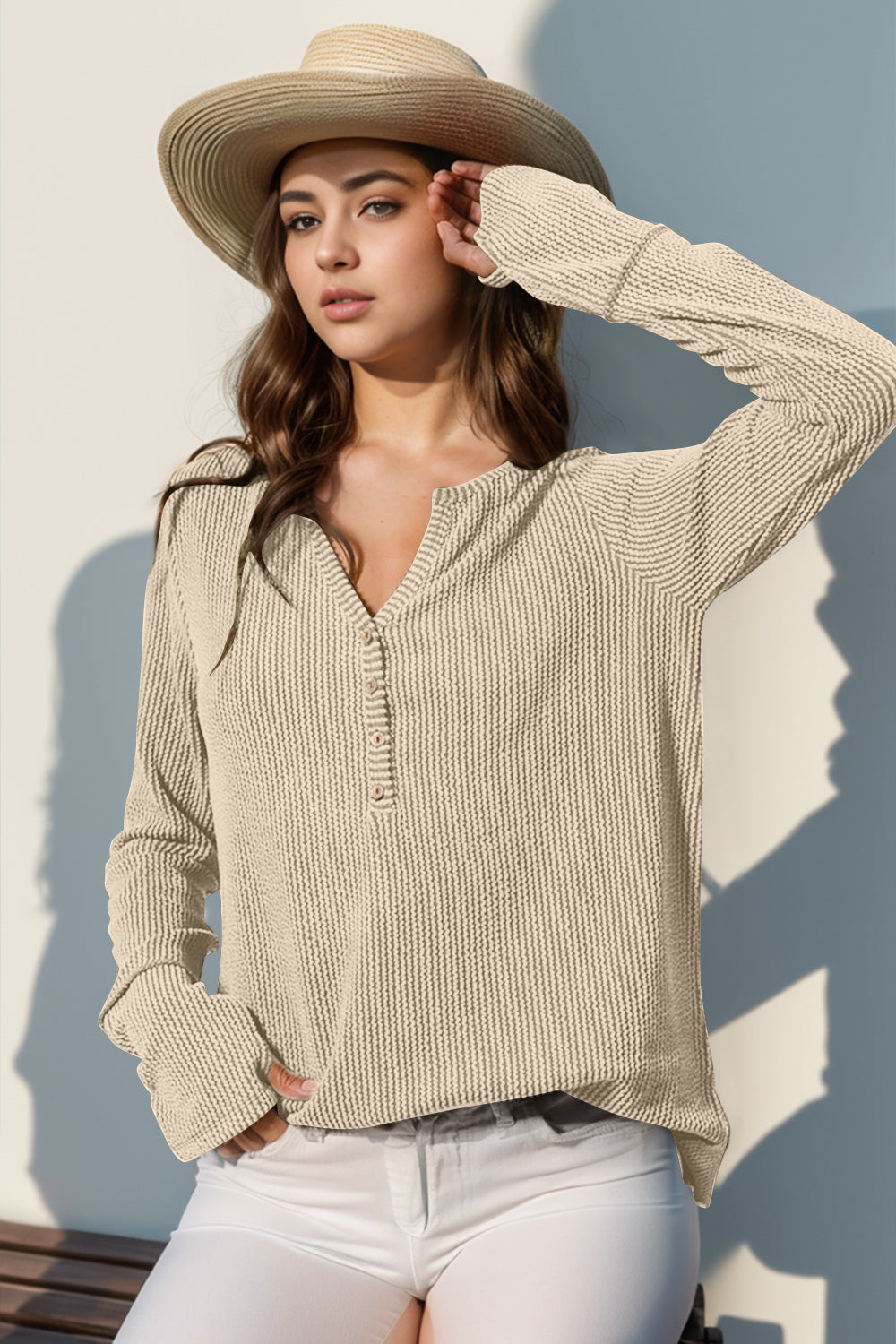 Waffle knit henley shirt in tan with button placket and thumbhole cuffs.