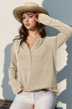 Waffle knit henley shirt in tan with button placket and thumbhole cuffs.