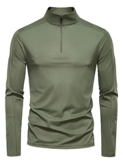 Moss green performance zip-neck tee with structured shoulders and long sleeves.