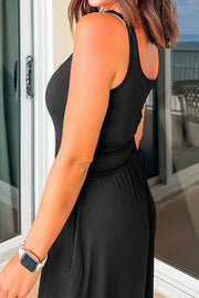 Black wide-leg jumpsuit with racerback and keyhole cutout detail.