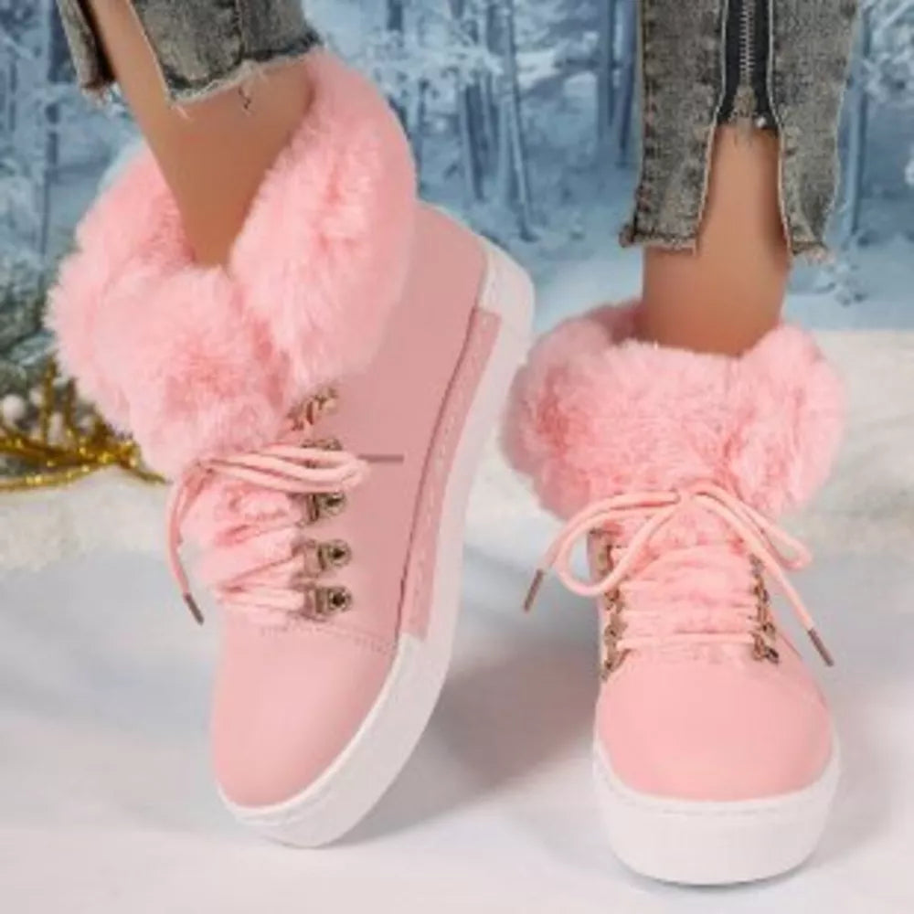 Pink fluffy cuff round-toe platform boots with white laces and contrasting sole.
