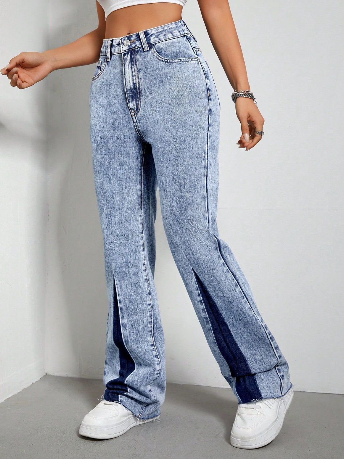 Light acid wash bootcut jeans with split hem detail