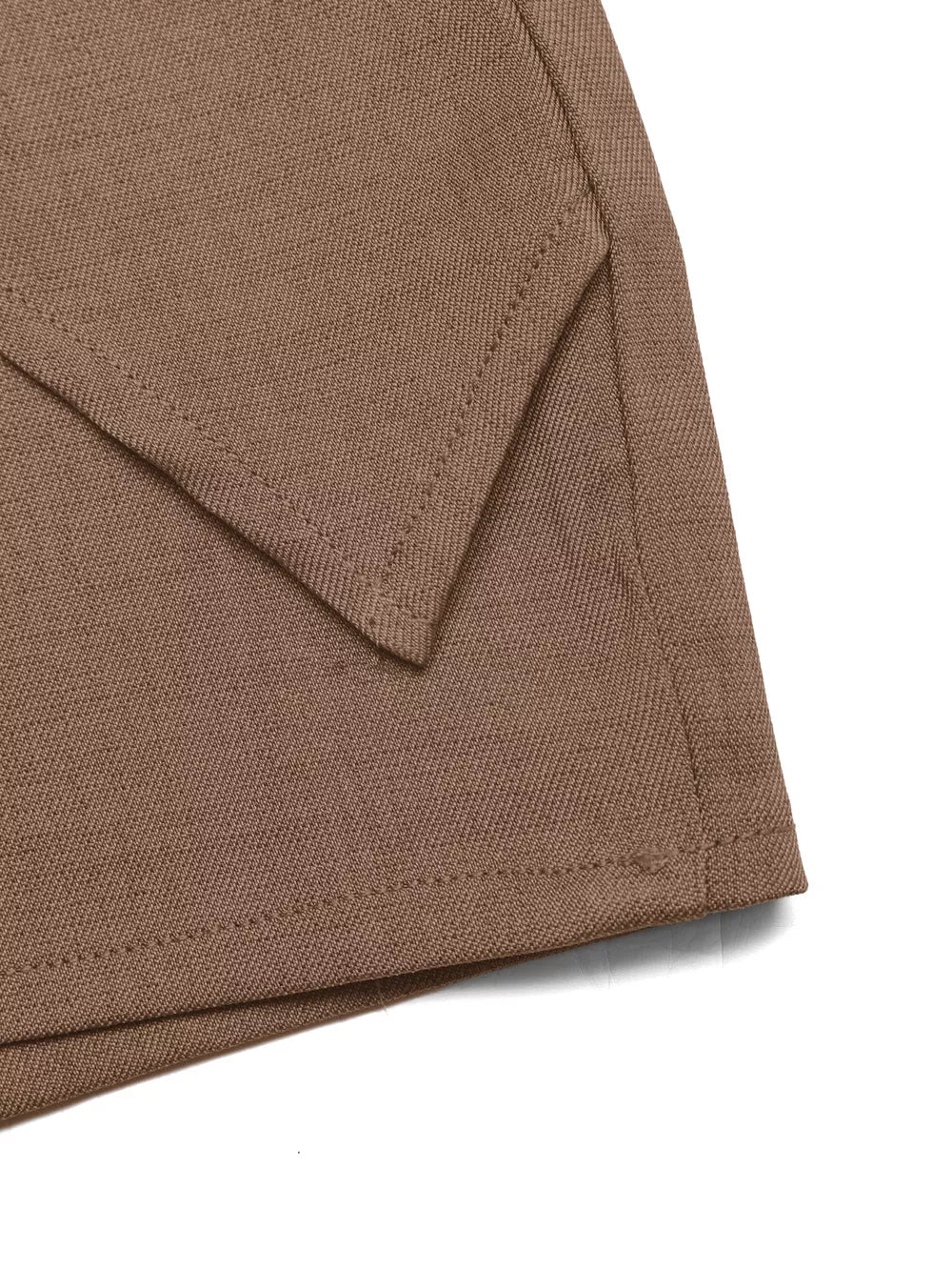 Brown twist-front skort with decorative button detail and angled hem.