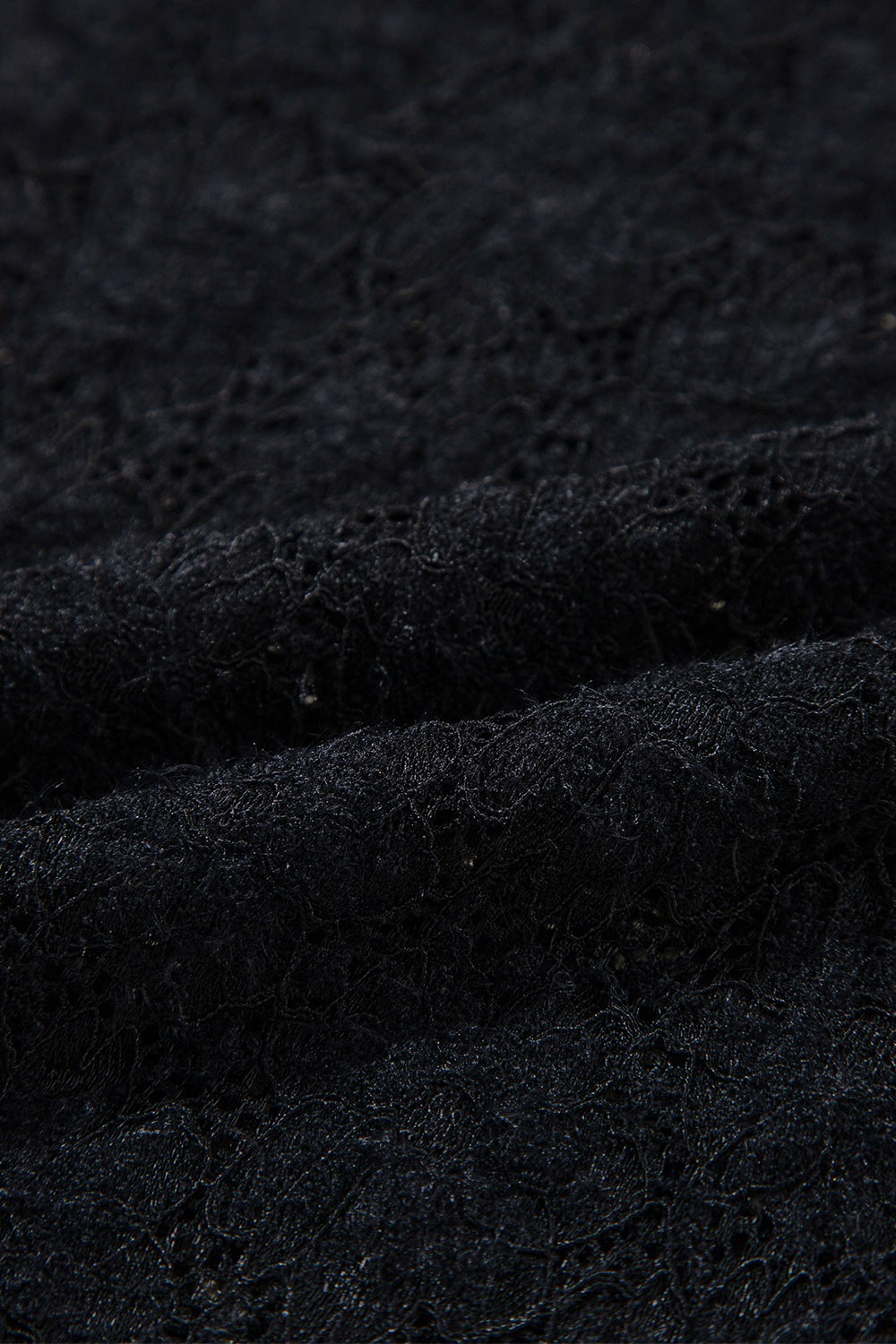 Black floral lace turtleneck top with a second-skin fit.