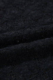 Black floral lace turtleneck top with a second-skin fit.