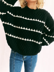 Black textured knit jumper with white chevron stripes and crew neck.