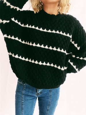 Black textured knit jumper with white chevron stripes and crew neck.