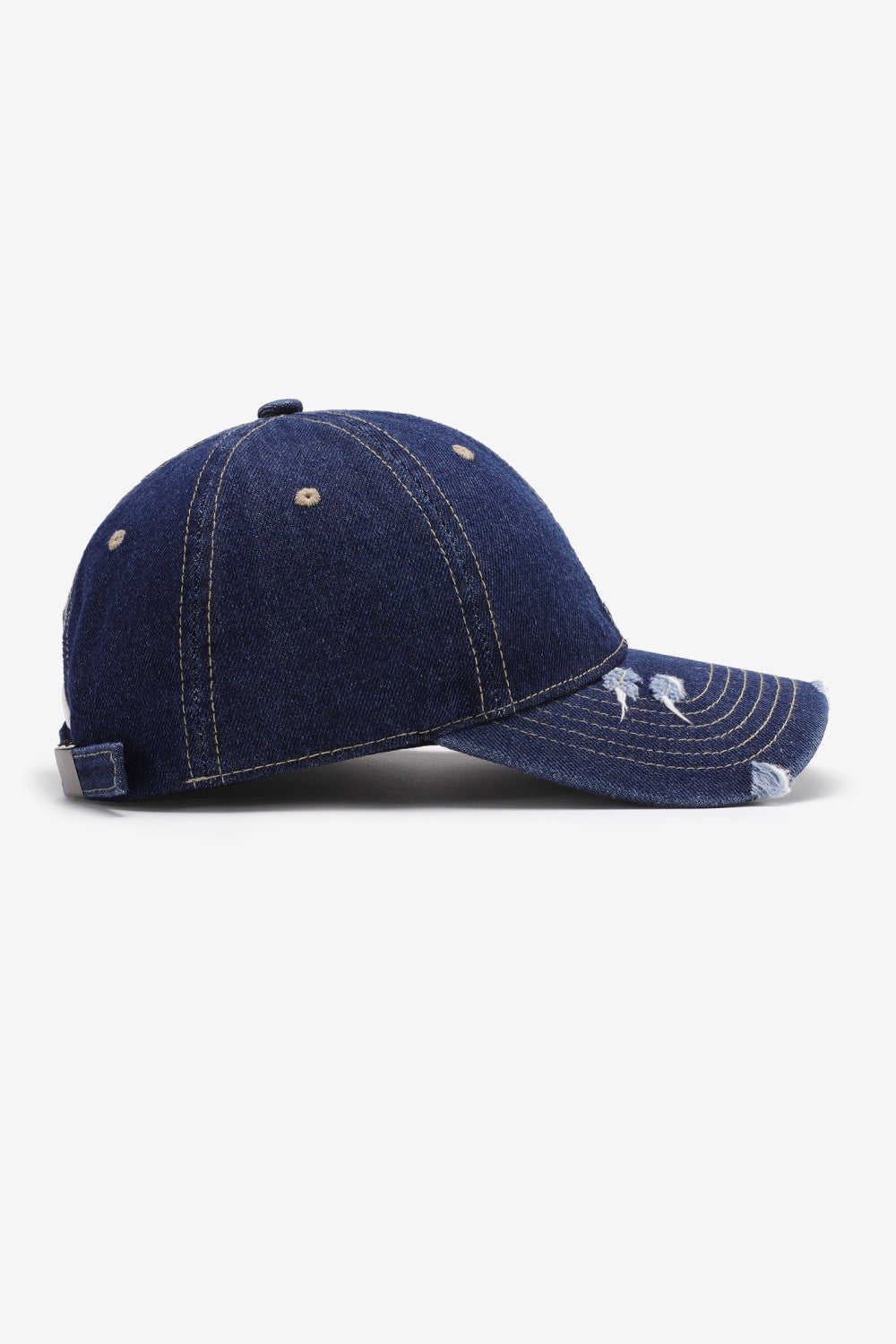 Denim baseball cap in dark navy with distressed brim and adjustable strap