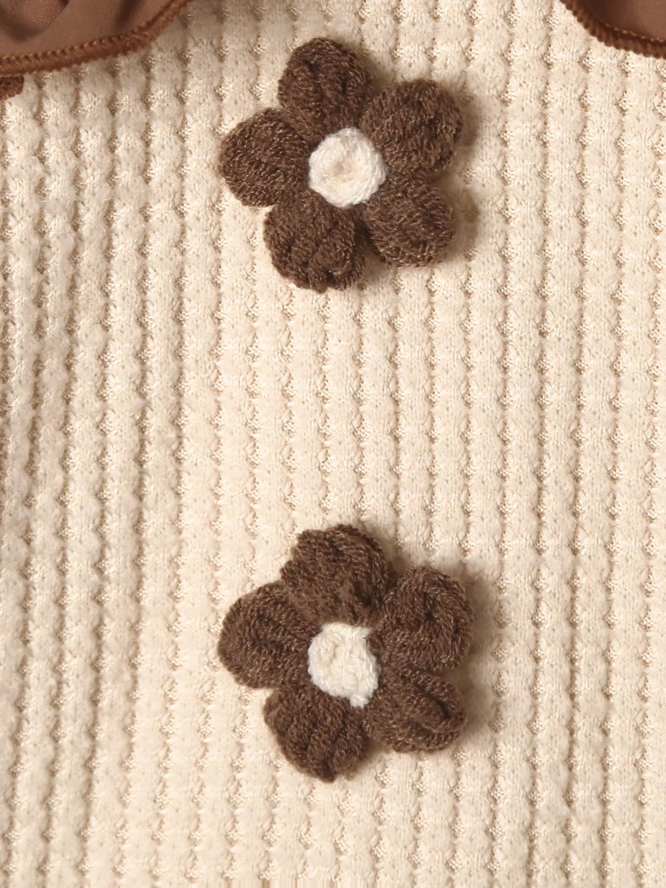 Baby two-piece set in tan waffle knit with brown floral appliques and ruffled trim.