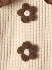 Baby two-piece set in tan waffle knit with brown floral appliques and ruffled trim.