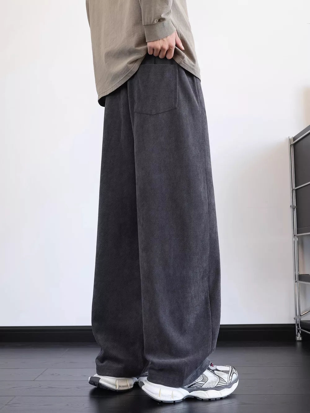 Men's gray wide-leg sweatpants with a back pocket detail.