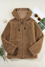 Brown sherpa hooded jacket with contrast lining and zip closure.