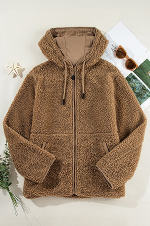 Brown sherpa hooded jacket with contrast lining and zip closure.