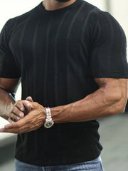 Black ribbed knit tee with vertical stripe texture and short sleeves.