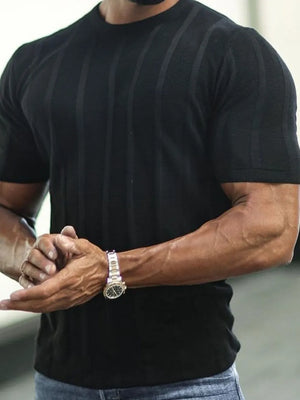 Black ribbed knit tee with vertical stripe texture and short sleeves.
