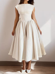 Elegant cream cap sleeve a-line midi dress with boat neck and full skirt.