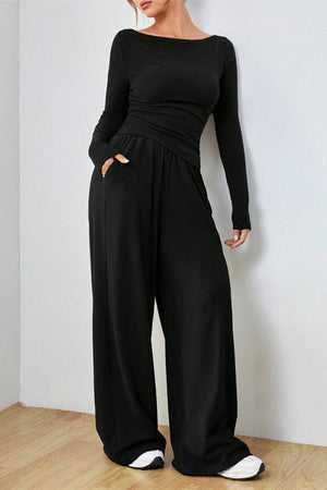 Black boat neck loungewear set with long sleeves and wide-leg pants with pockets.