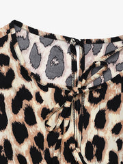 Leopard print jumpsuit with tie-neck detail and puff sleeves