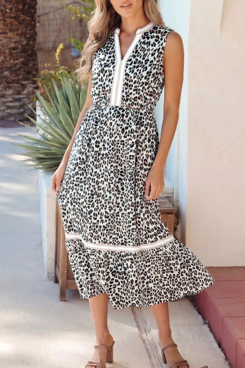 Leopard print midi dress with V-neck and colorblock detail.