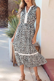 Leopard print midi dress with V-neck and colorblock detail.