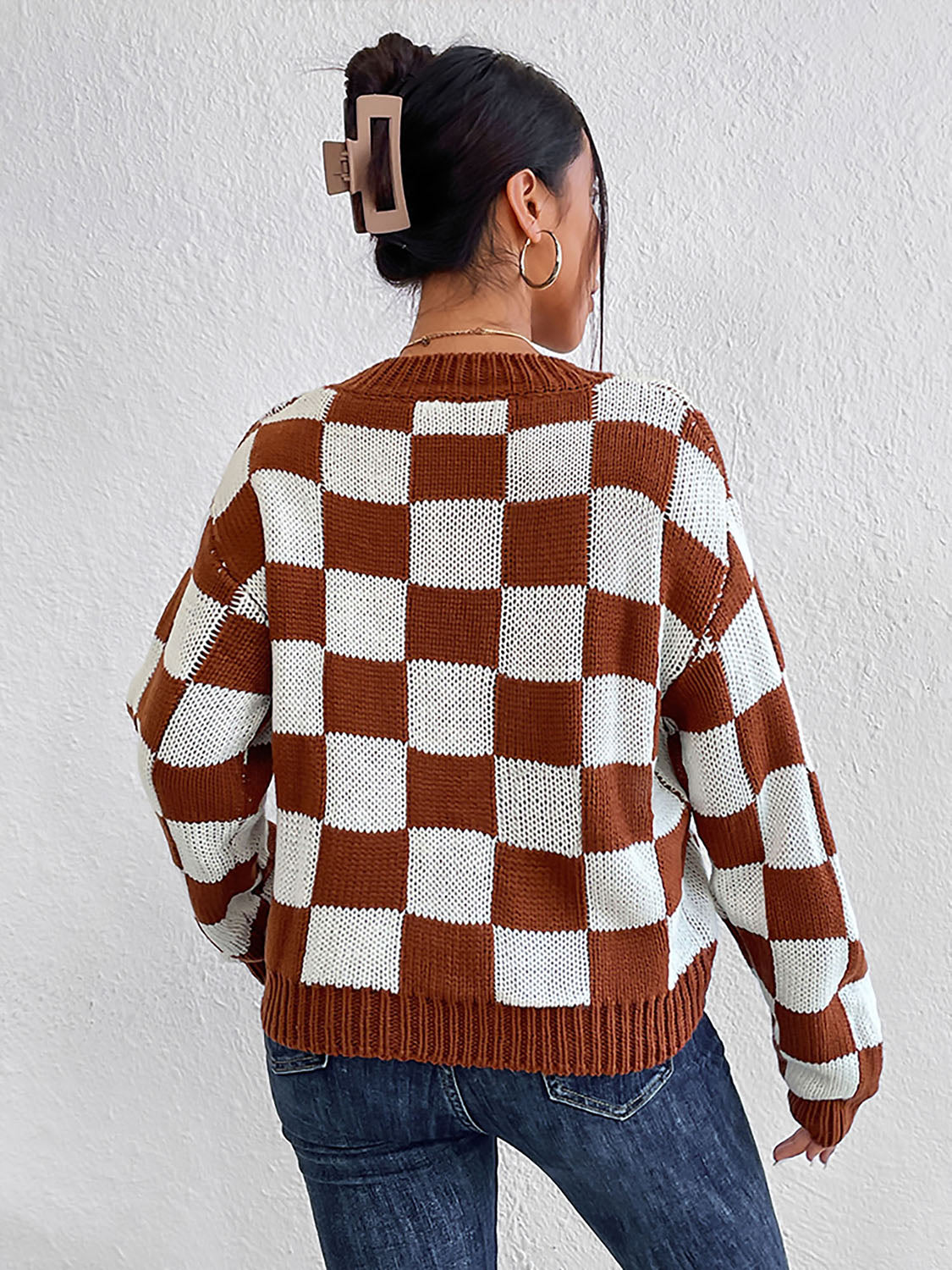 Checkerboard knit crewneck pullover sweater in chestnut and white acrylic.