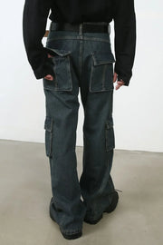 Panelled dark denim cargo pants with multiple utility pockets and a relaxed fit.