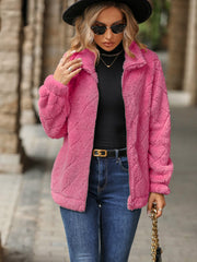 Pink textured teddy zip-up jacket with a diamond pattern, collared neckline, and long sleeves.