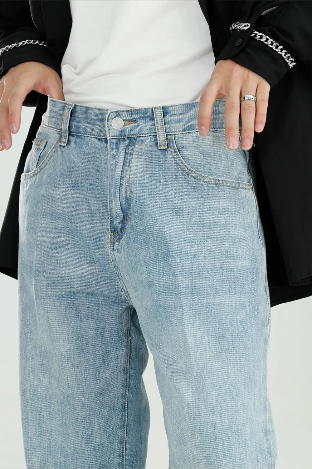Relaxed fit light wash denim jeans with a modern wide leg cut.
