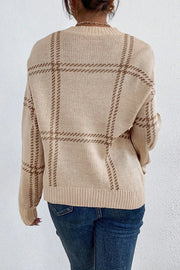 Tan gridline knit crewneck pullover sweater with long sleeves and ribbed cuffs and hem.