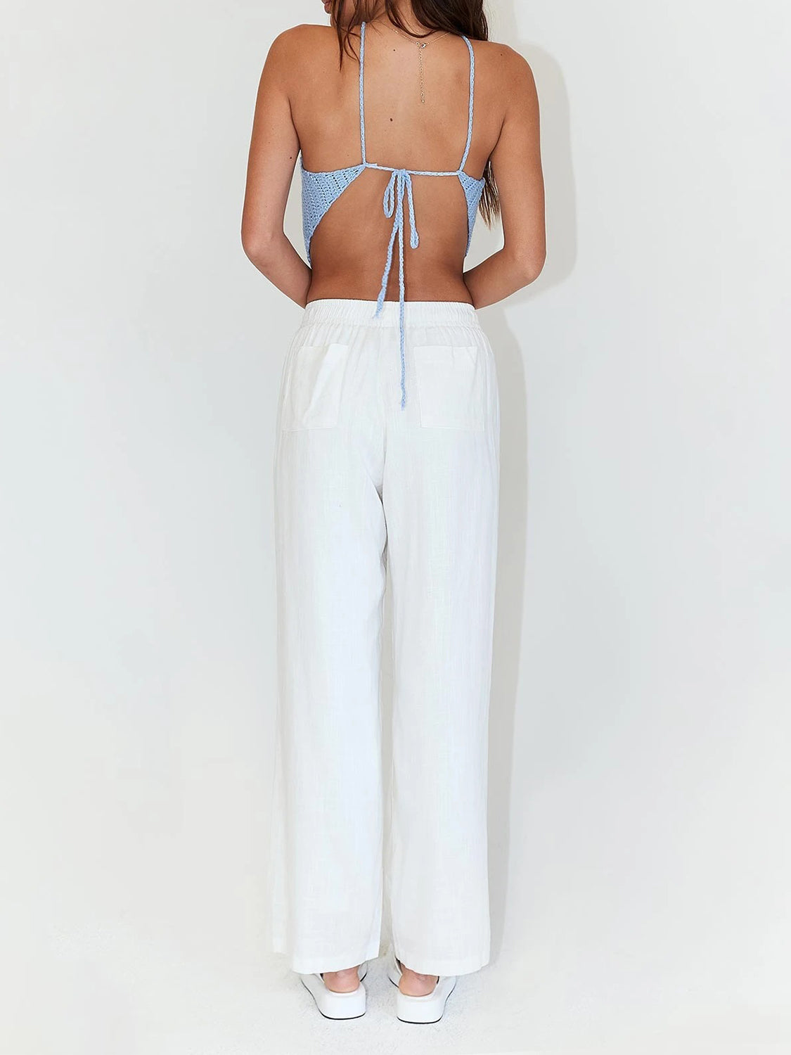 Light blue crochet halterneck triangle top with back tie detail.