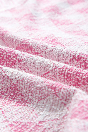 Pink diamond weave shacket fabric detail with textured weave and puff sleeve detail.