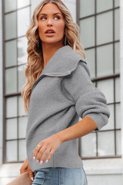 Gray ribbed knit cardigan with shawl collar and cuffed sleeves.