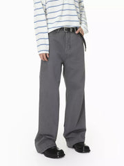 Men's grey cotton relaxed fit jeans with button closure and braided belt.