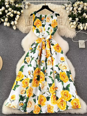 Vibrant floral midi dress with yellow roses and pleated skirt.
