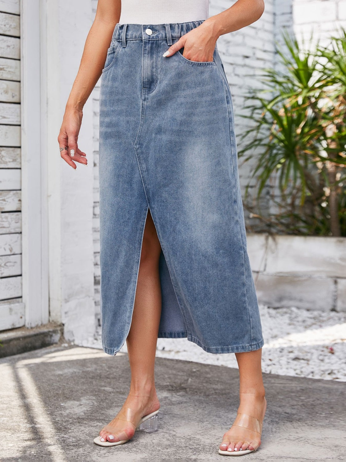 Light blue denim midi skirt with elastic waist and front slit