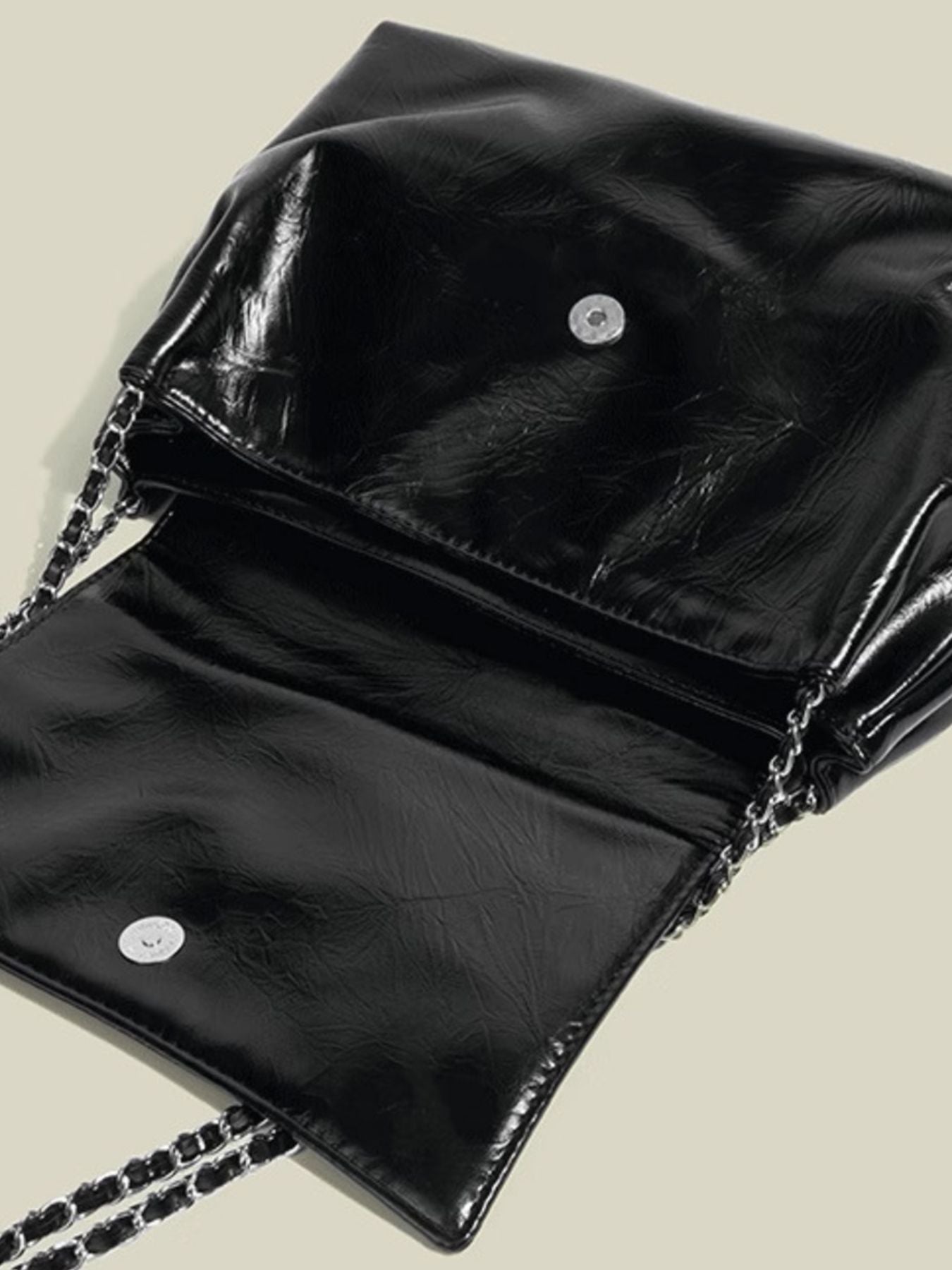 Black crinkled pu leather shoulder bag with chain strap and snap closure detail