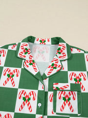 Green checkered pajama top with candy cane print, button front, and pocket detail.