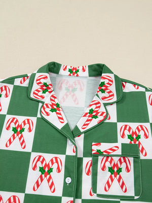 Green checkered pajama top with candy cane print, button front, and pocket detail.