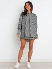 Oversized black and white stripe shirting set with a button-up top and matching shorts.