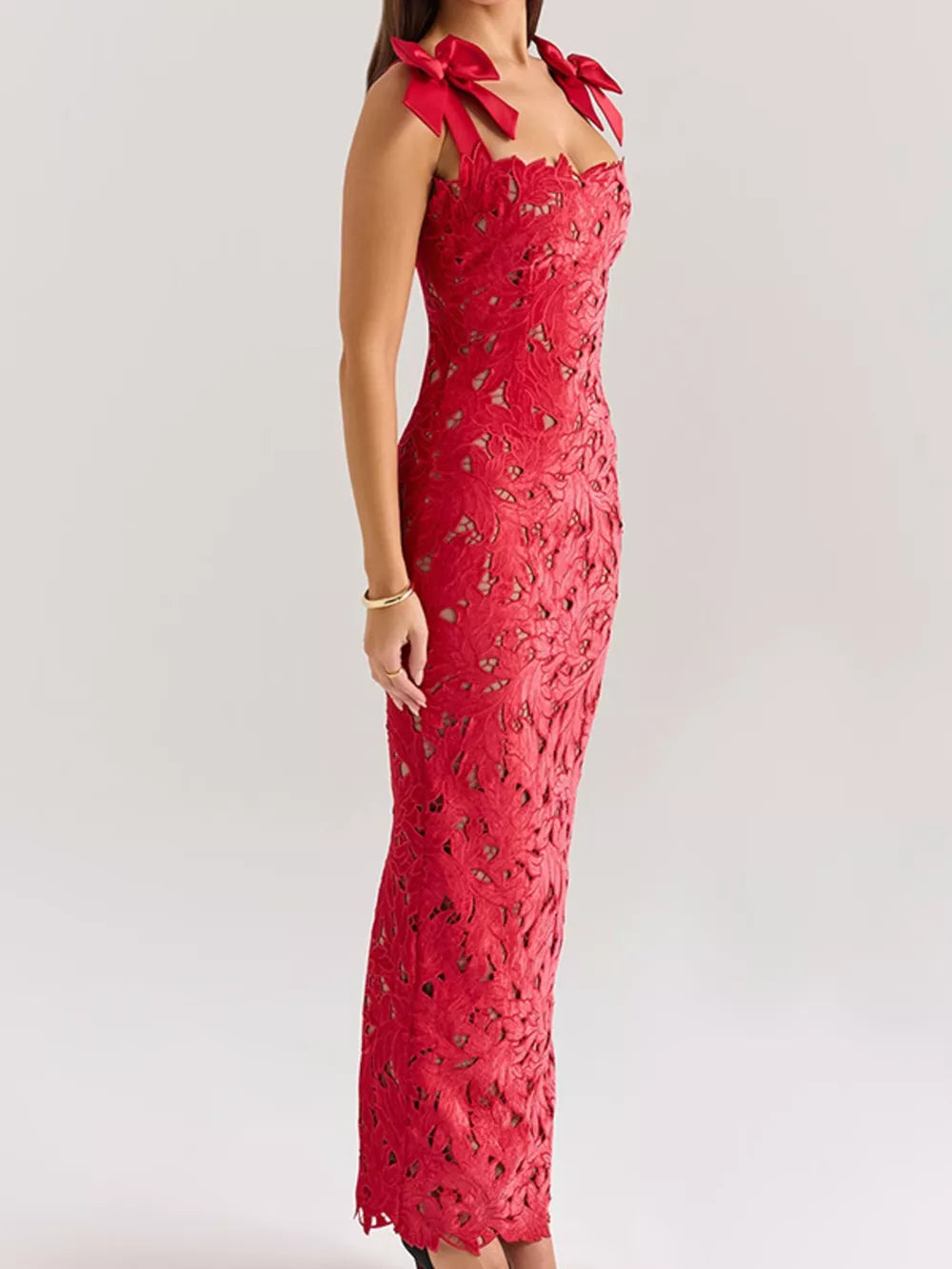 Red floral lace maxi dress with tie shoulder bows and cutout detail.
